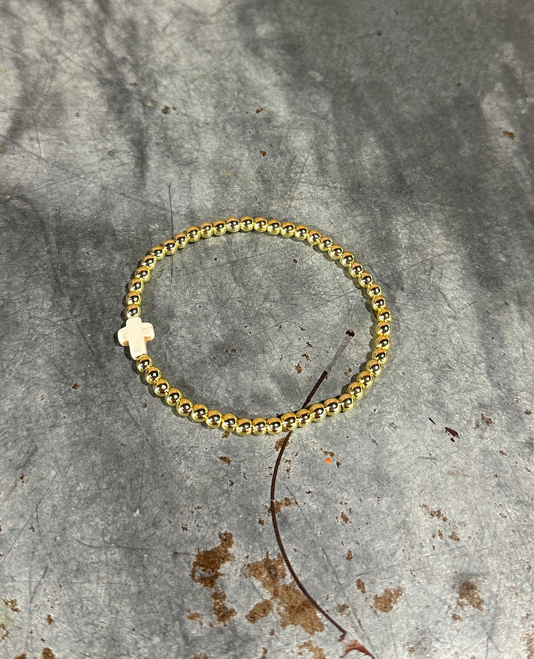Gold cross beaded bracelet